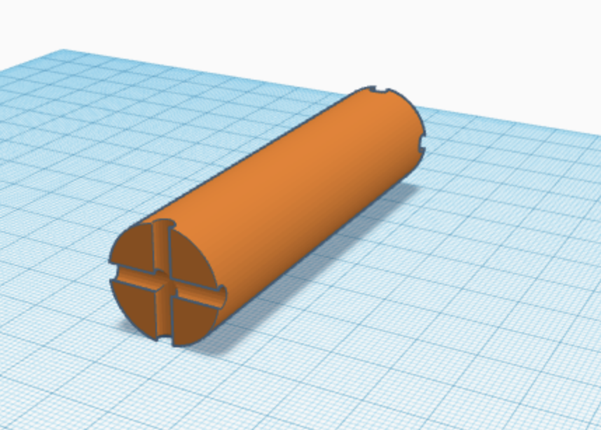 3D rendering of Design 4 which is a cylinder with cross divots on the faces of the cylinder